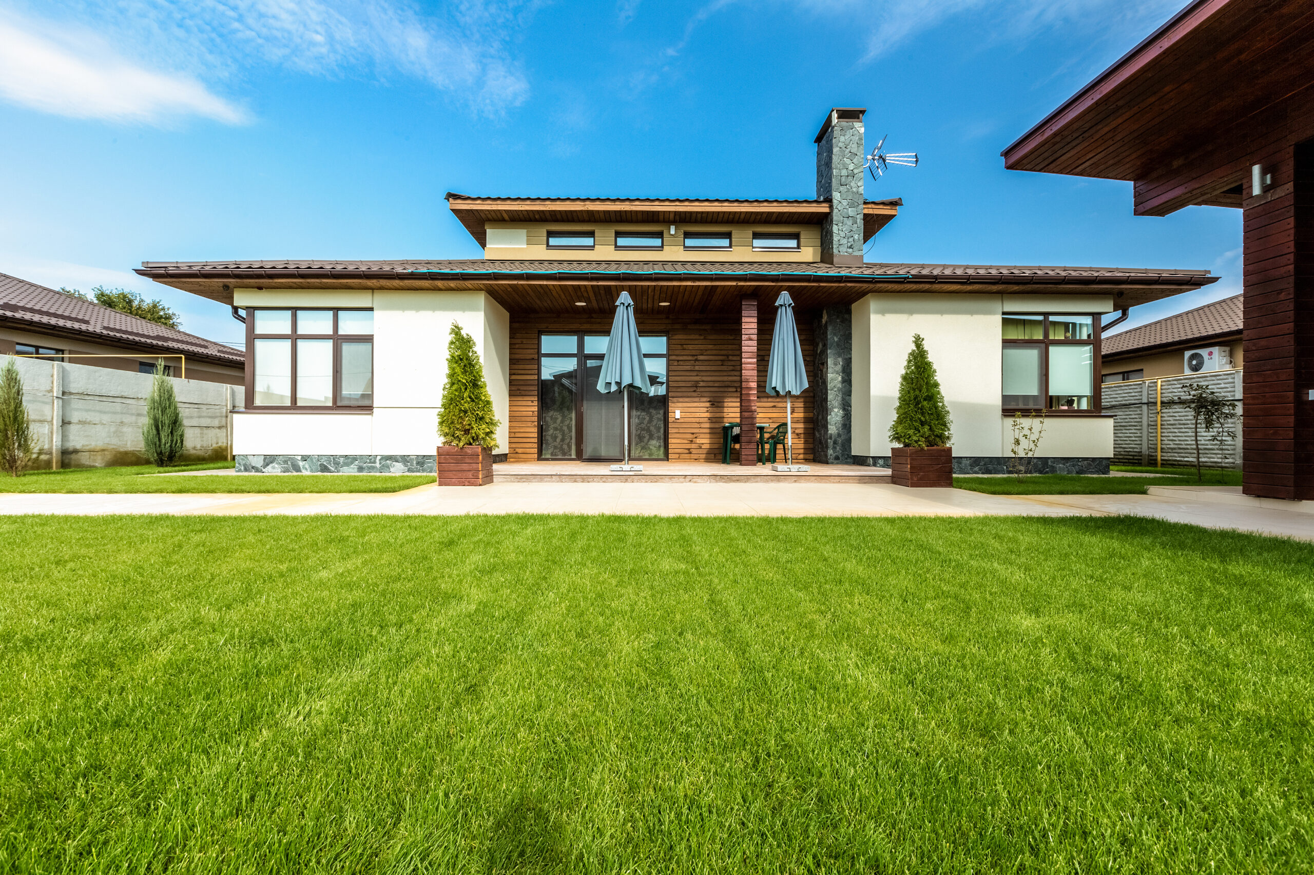 Beautiful modern house in cement, view from the garden